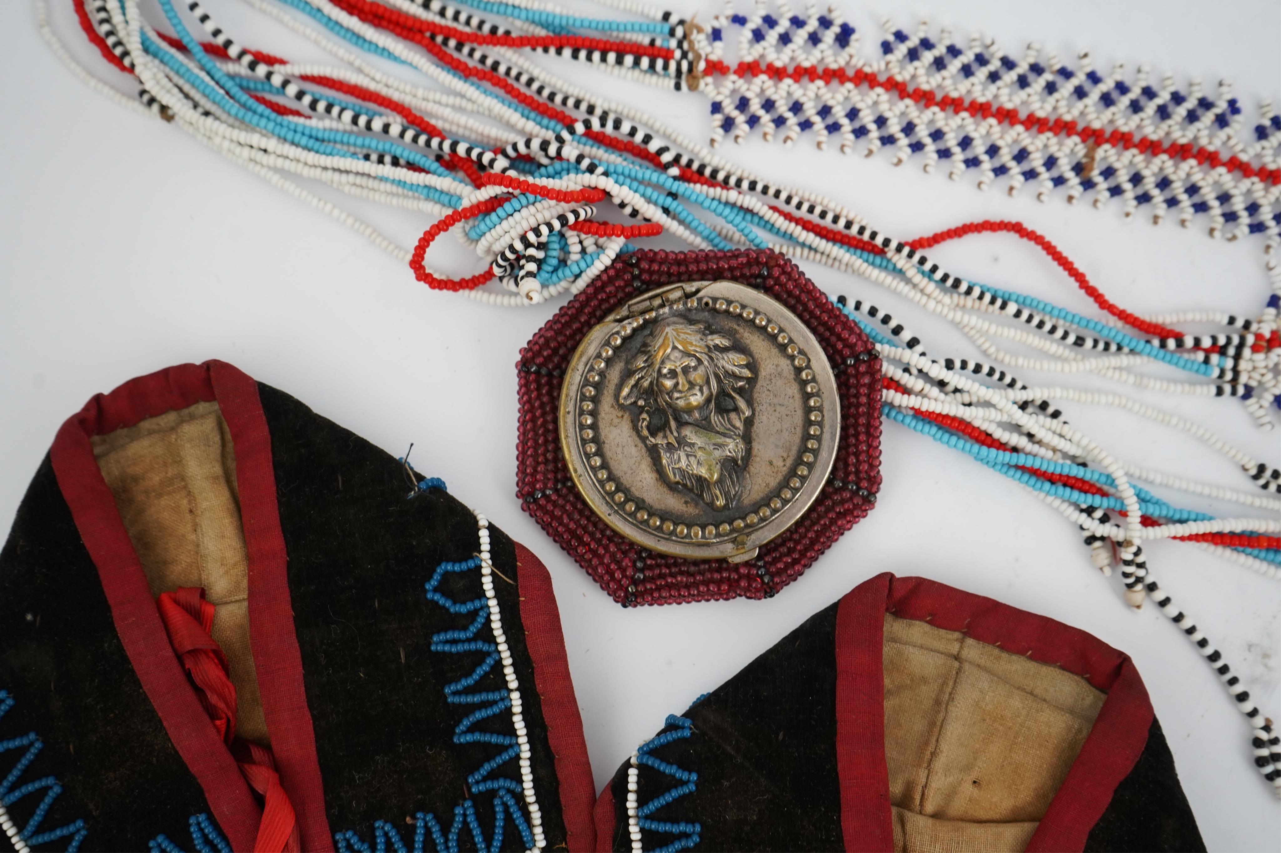 A collection of mixed decorative bead work, including five items of Native American beadwork, together with an early beadwork bag and later beaded items. Condition - moccasins, bead panel, circular bed purse with metal l